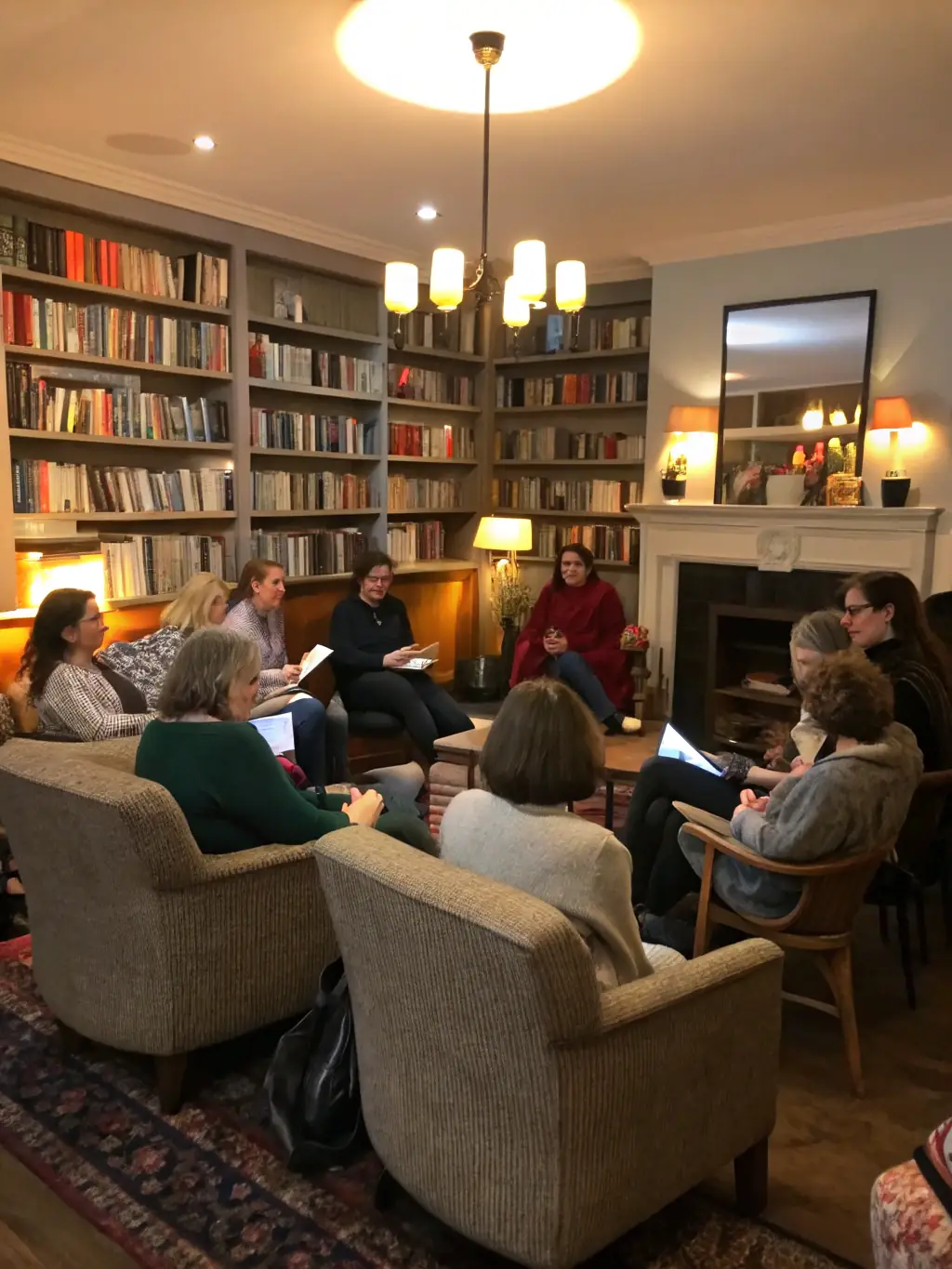 Adults attending a book club meeting, discussing the themes and characters of a selected novel in a cozy setting at the Vichy Val d'Allier library.